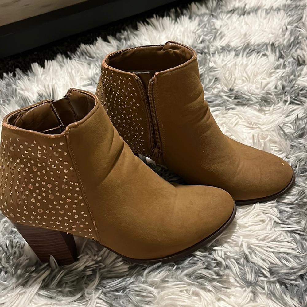 Tan boots with fun heel.